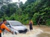 Tingginya intensitas curah hujan, mengakibatkan ruas jalan merdeka km 10 kelurahan Handayani Mulya kecamatan Talang Ubi Kabupaten Penukal Abab Lematang Ilir (PALI)