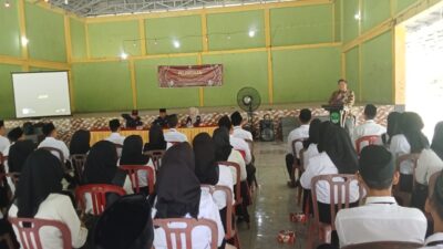 Polsek Penukal Utara Hadiri Pelantikan Kelompok Penyelenggara Pemungutan Suara di Gedung Serba Guna Desa Tanding Marga