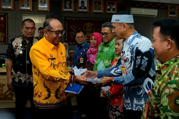 Pj, Bupati Lampung Utara Pimpin Rapat Penyerahan Rekor LHP Kinerja BPK dan LHP Inspektorat Propinsi Lampung T/A 2024