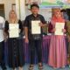 Kepala Kantor Pertanahan Kabupaten Bondowoso Serahkan Sertipikat PTSL di Balai Desa Sumber Canting